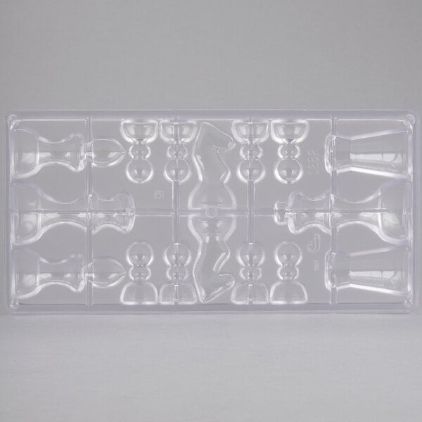A clear plastic Matfer Bourgeat chocolate mold with 16 compartment chess pieces.