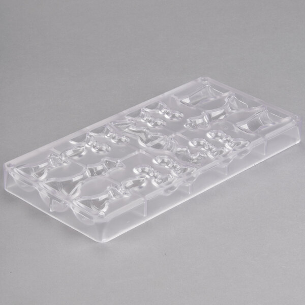 A clear plastic Matfer Bourgeat chocolate mold with 16 chess piece compartments.