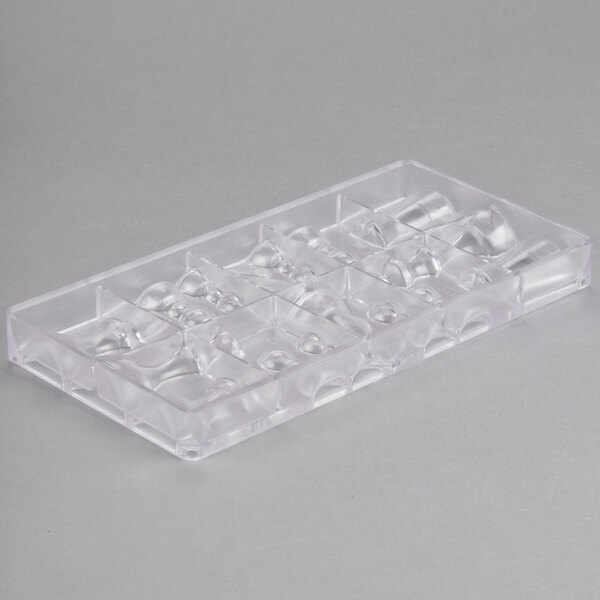A clear plastic Matfer Bourgeat chocolate mold tray with 16 chess piece compartments.