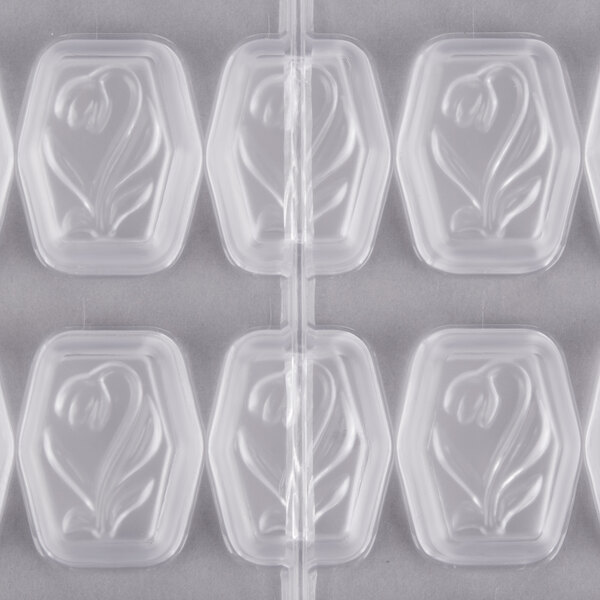 A white Matfer Bourgeat plastic mold tray with 36 tulip rectangle designs.
