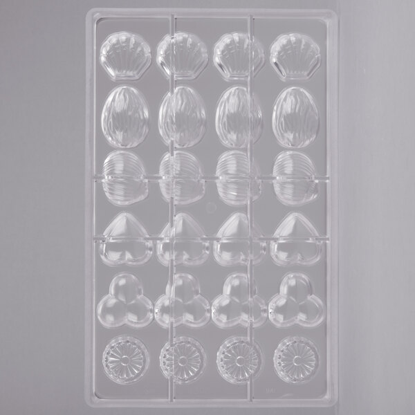 A clear plastic Matfer Bourgeat chocolate mold with different shapes.