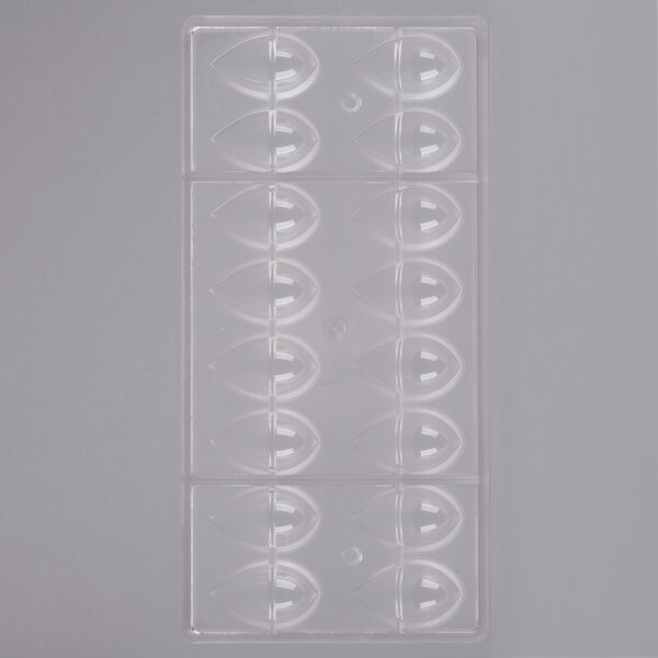 A clear plastic Chocolate World mold with 16 oval compartments.