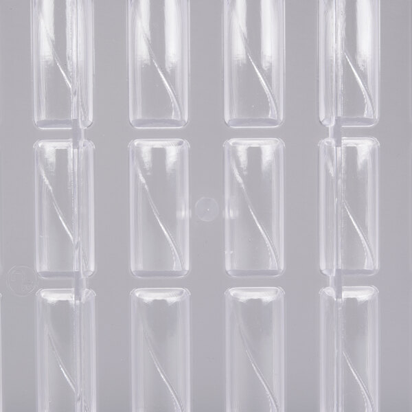 A clear plastic rectangular container holding a white polycarbonate chocolate mold with 24 bullion compartments.