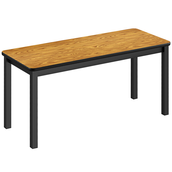 A Correll library table with a medium oak top and black legs.