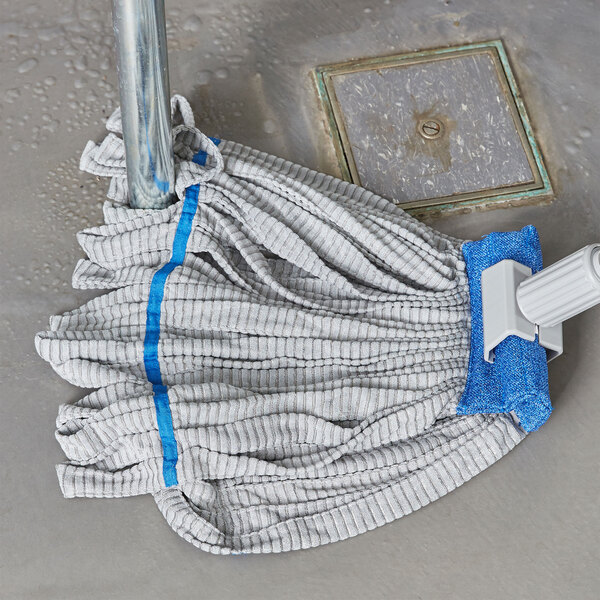A blue Unger SmartColor microfiber string mop head on a pole.