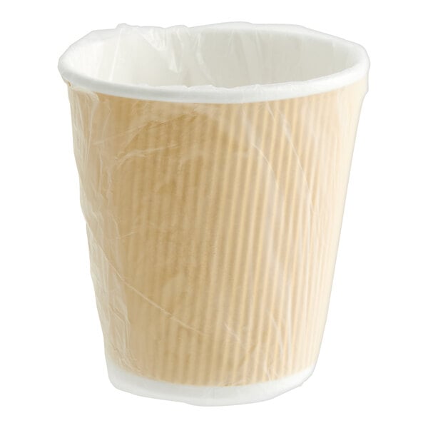 A Lavex Kraft paper hot cup with plastic wrap on it.