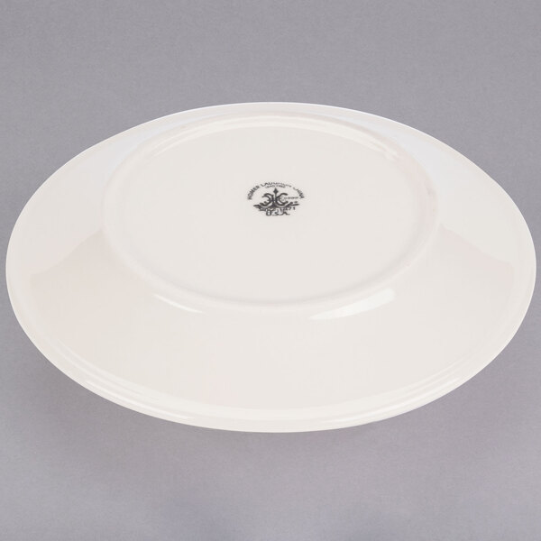 A white Homer Laughlin checkers plate with a black checkered design.