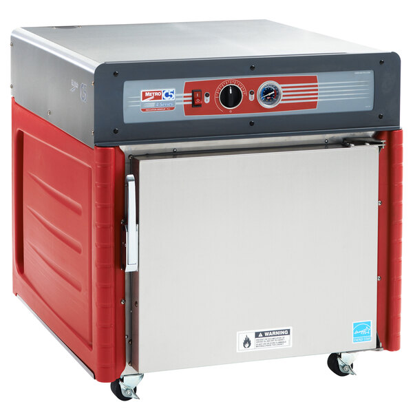 A Metro stainless steel hot holding cabinet on wheels.