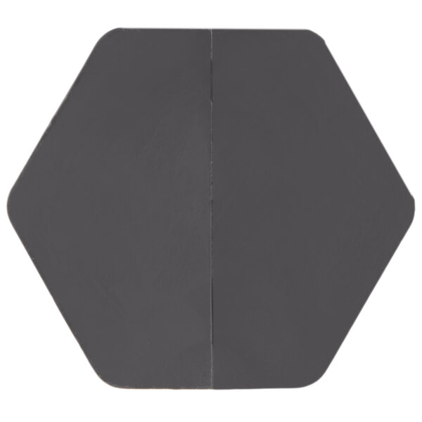 A grey hexagon shaped object with a black center.