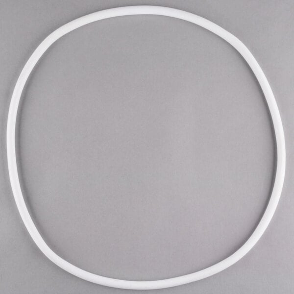 A white plastic gasket for a front loading food pan carrier.