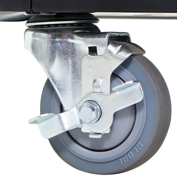 A black and silver metal wheel on a Luxor tablet charging station.