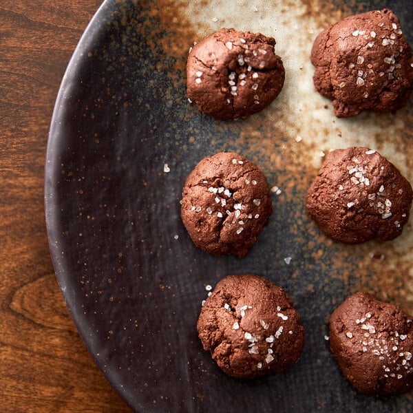 A plate of brown cookies with Regal Coarse Sea Salt on top.