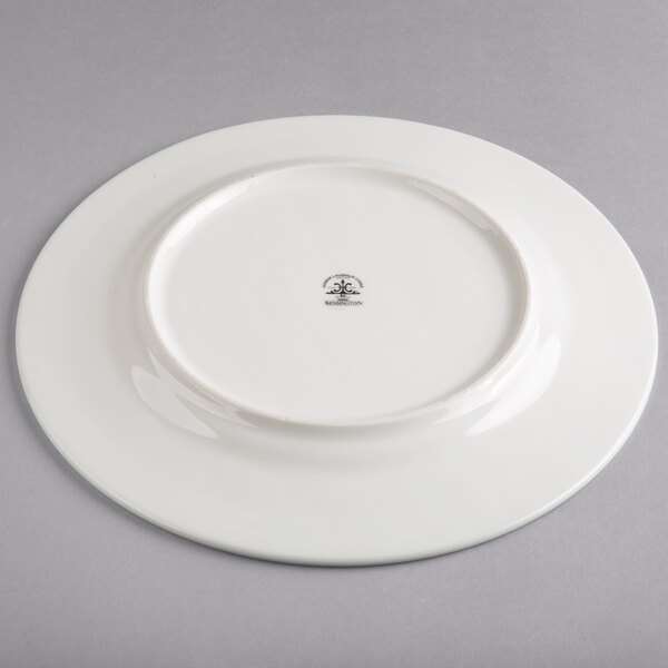 A Homer Laughlin bright white china plate with a black design on it.