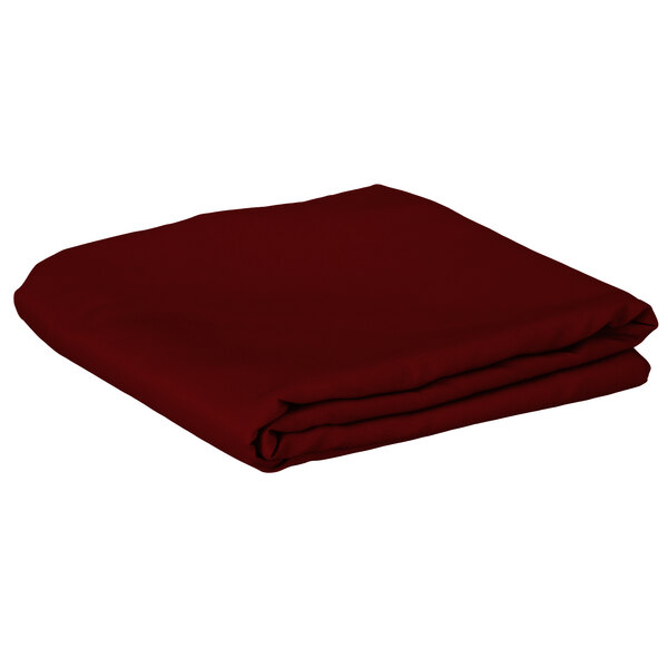 A folded burgundy Intedge square table cover.