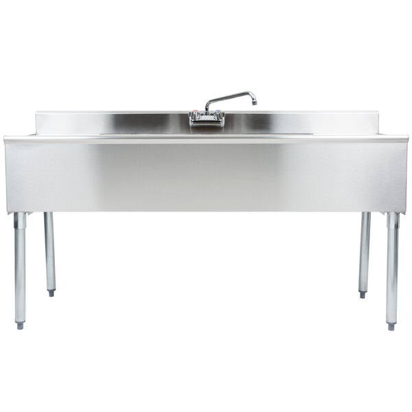 A stainless steel Eagle Group underbar sink with two drainboards and a faucet.