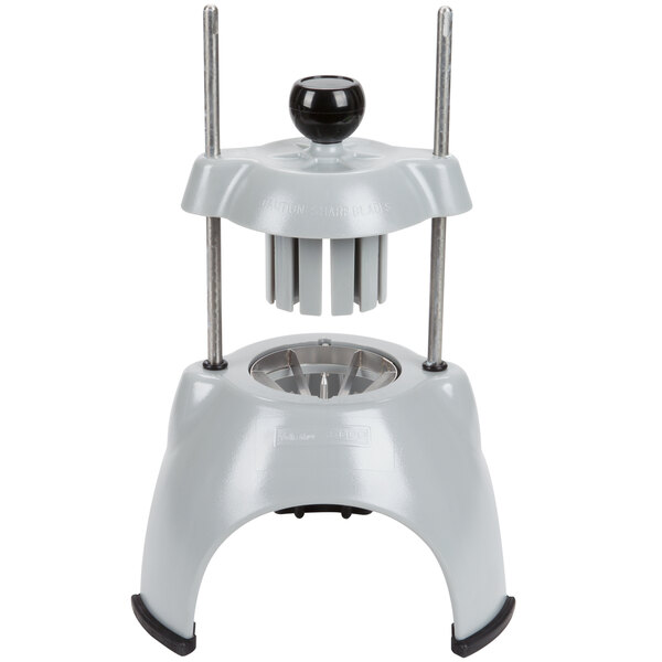 A white machine with black handles for wedging food.