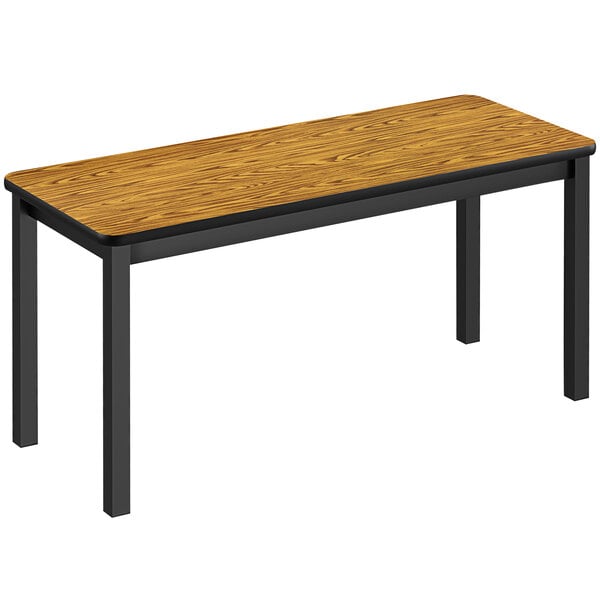 A medium oak rectangular library table with black legs.