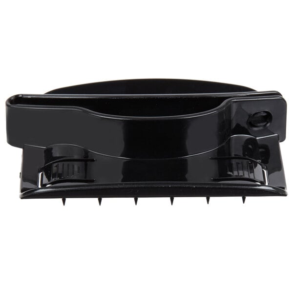 A black plastic hand guard with spikes.