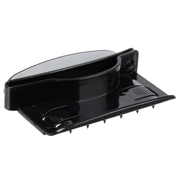 A black plastic hand guard with spikes.