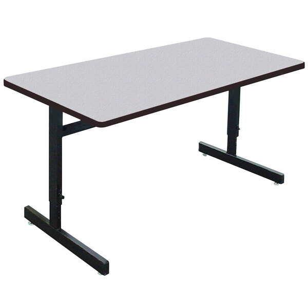 A rectangular Correll table with black metal legs and a gray granite top.