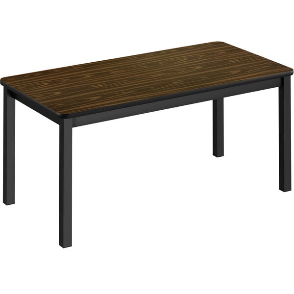 A Correll walnut library table with black legs.