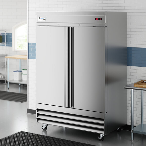 A stainless steel, double-door reach-in refrigerator on casters.