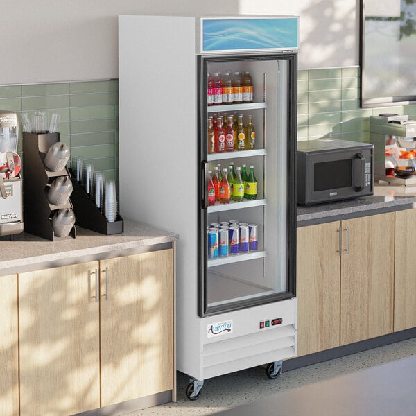 An Avantco white customizable glass door refrigerator full of drinks.
