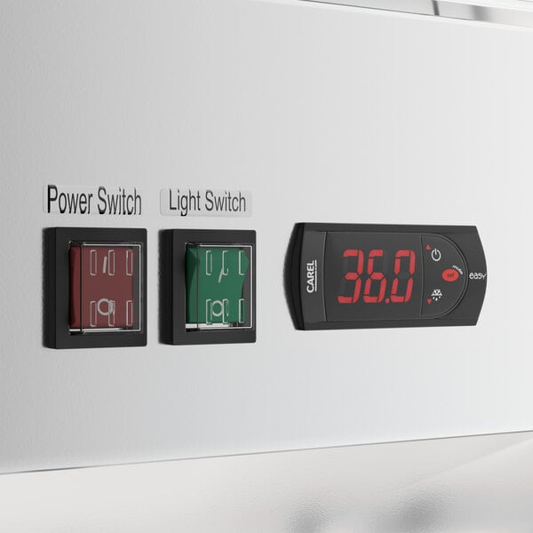 A white customizable swing glass door merchandiser refrigerator with LED lighting, featuring labeled power and light switches and a digital temperature display.