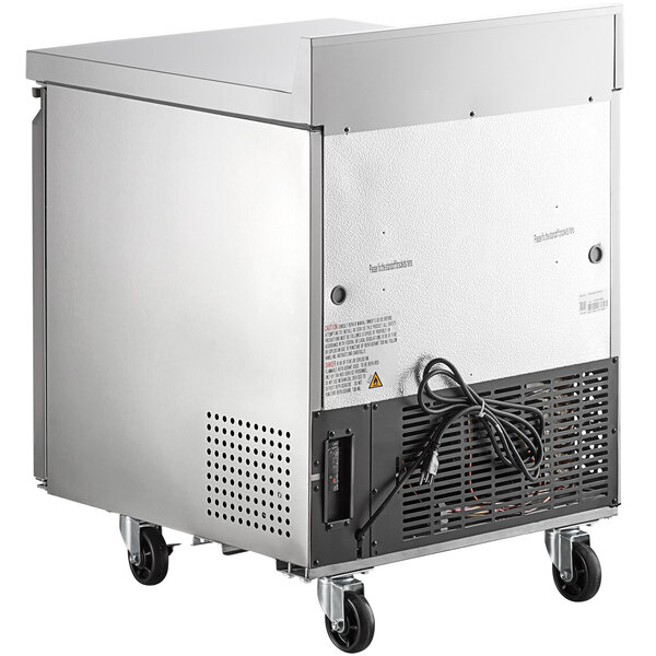 An Avantco stainless steel worktop refrigerator with a wire rack inside.