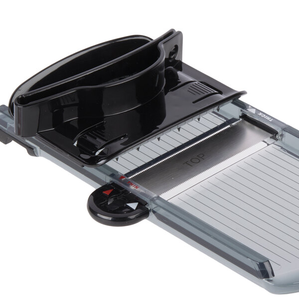 A black and clear plastic Mercer Culinary hand slicer blade.