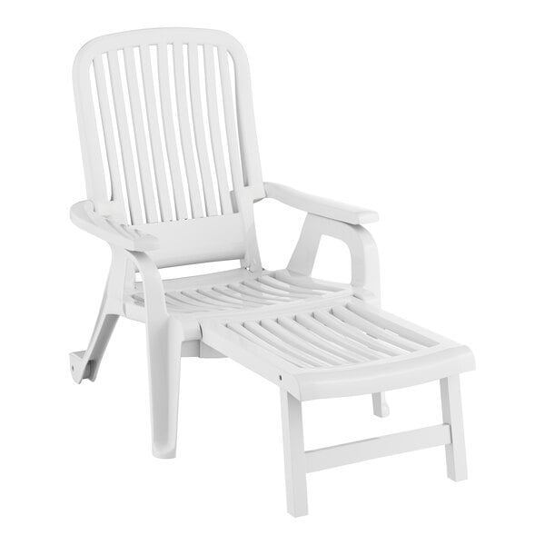 A white Grosfillex plastic Bahia chaise lounge chair with a pull-out footrest.