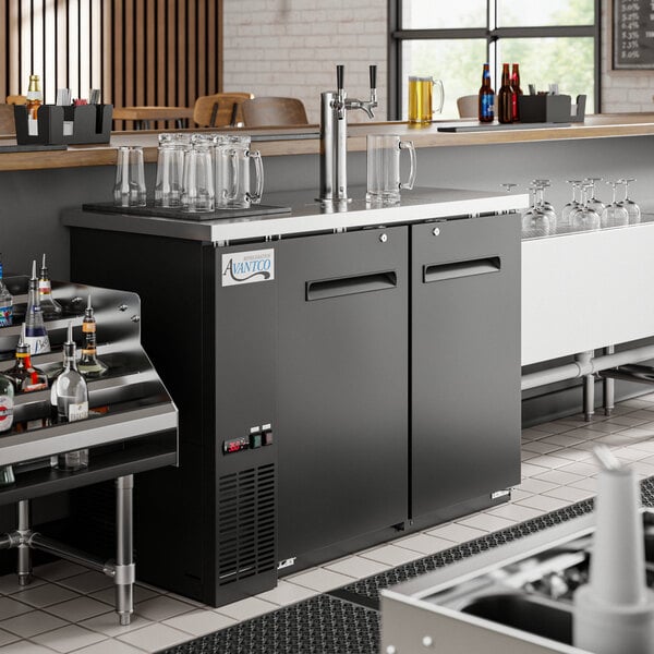 An Avantco double tap kegerator built into a bar counter.