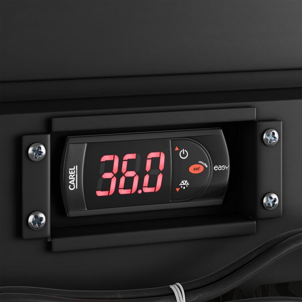 An Avantco kegerator with a digital display on a black surface.