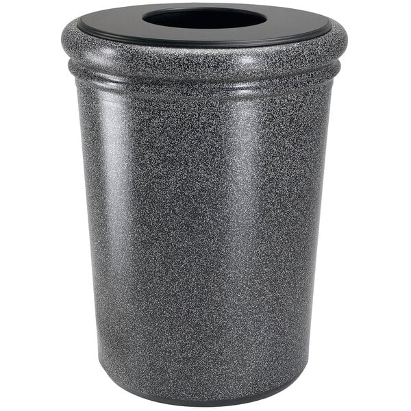 A gray stone trash can with a black lid.