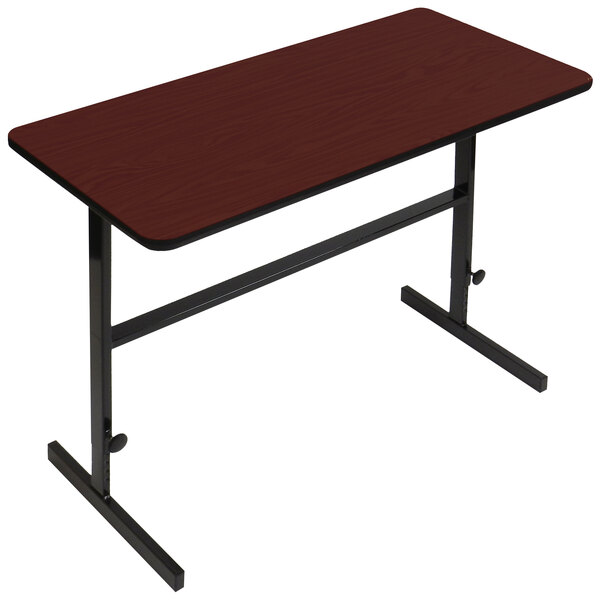 A brown rectangular table with a black frame and a red top.
