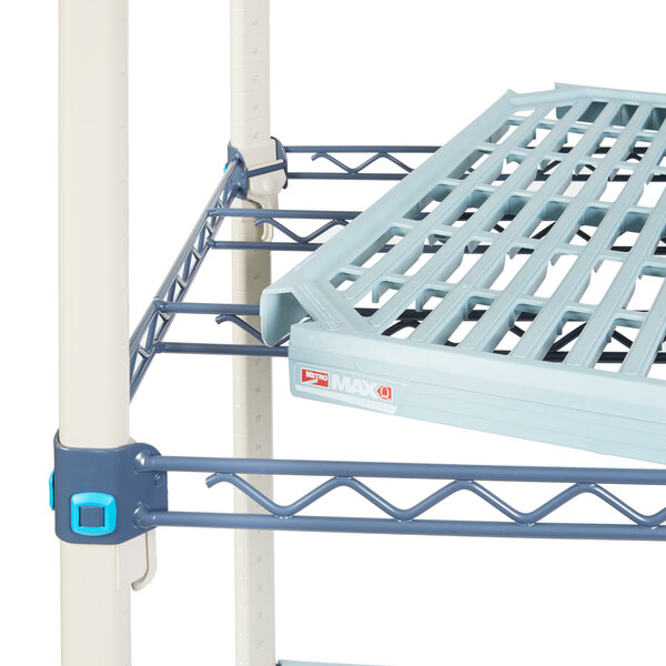 A MetroMax shelf cart with open grid shelves and polyurethane casters.