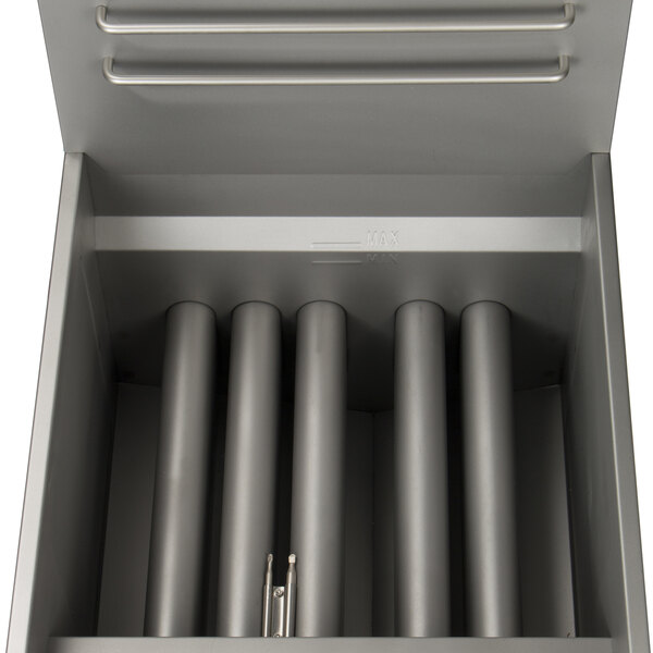 A stainless steel Globe gas fryer with metal tubes inside.