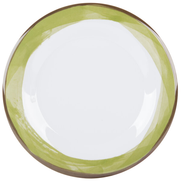 A white plate with a wide rim and a green border.