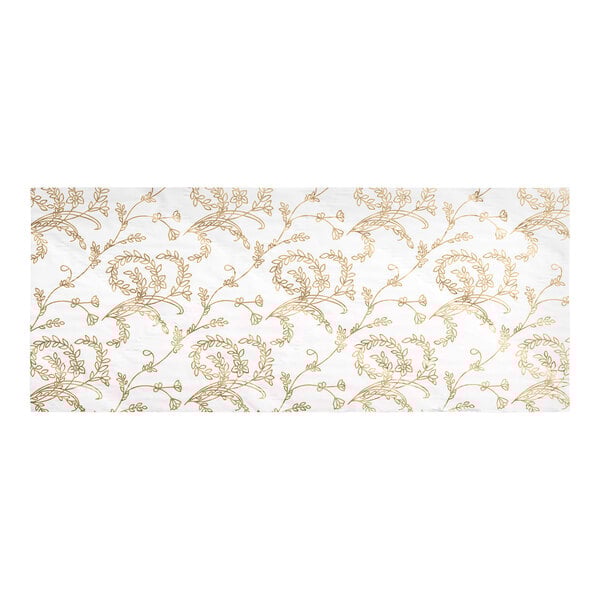 A white glassine candy box pad with a gold floral pattern.