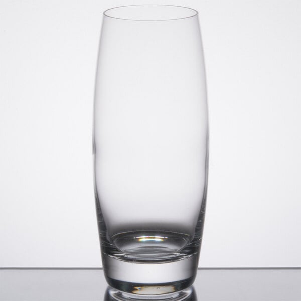 A close-up of a Reserve by Libbey highball glass on a reflective surface.