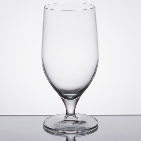A close-up of a Reserve by Libbey Neo wine glass on a reflective surface.