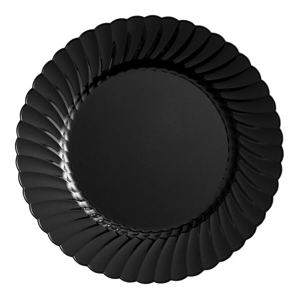 A WNA Comet black plastic plate with a scalloped edge.