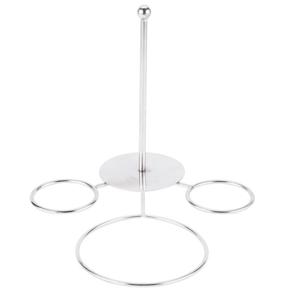 A silver metal stand with three rings and two ramekin holders.