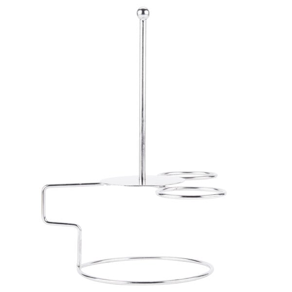 A Clipper Mill stainless steel stand with circular holders on a counter.