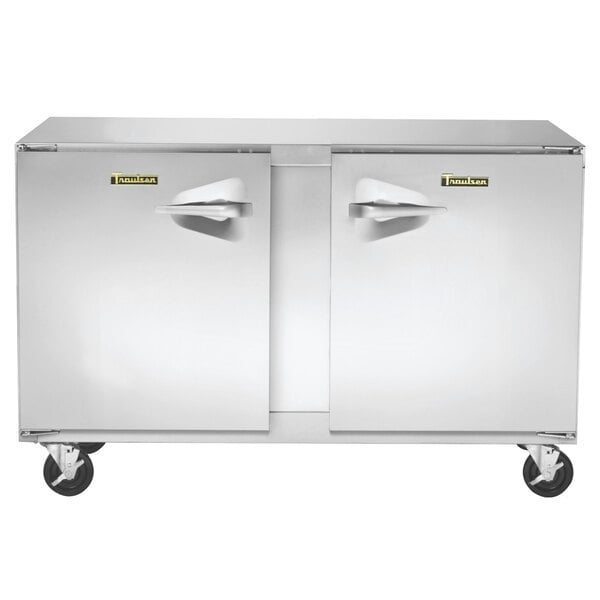 A Traulsen stainless steel undercounter freezer with left and right hinged doors and wheels.