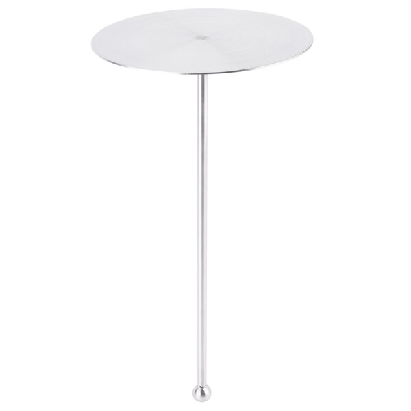 A Clipper Mill stainless steel pole with a round top on a table.