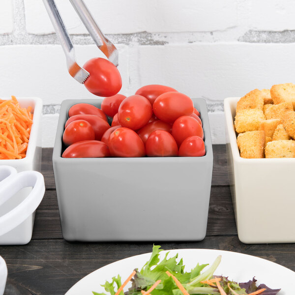 A Tablecraft gray bowl filled with cherry tomatoes