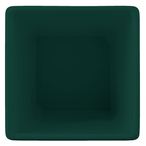 A dark green square bowl with white lines.