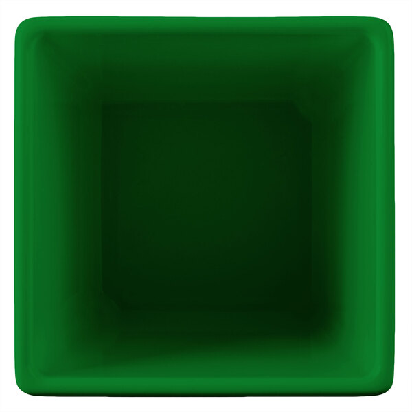A green square Tablecraft bowl with a white interior.