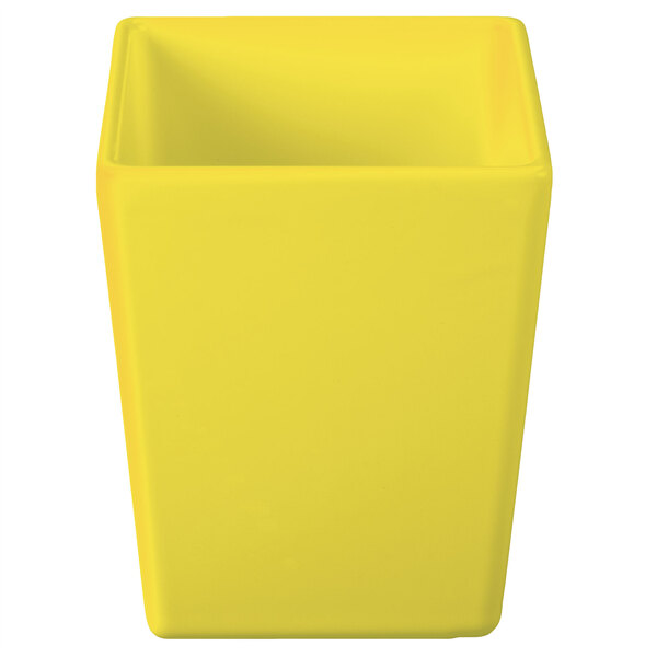 A yellow rectangular Tablecraft bowl with straight sides.